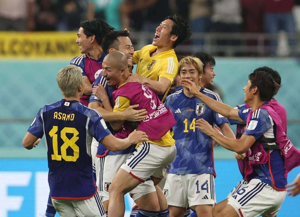 Japan's team celebrate an unlikely lead against Spain