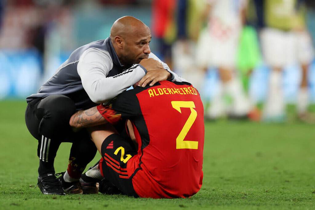 Belgium assistant coach Thierry Henry consoles and hugs Toby Alderweireld